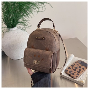 Detail of mini leopard print cat backpack with NINAITE metal logo and chain strap