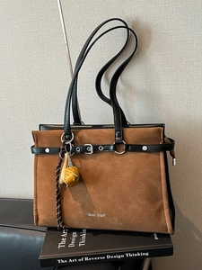 Vintage brown frosted leather tote bag with black straps and silver metal hardware