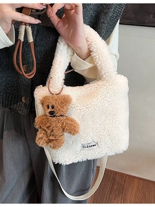 Cream faux shearling crossbody bucket bag with cute brown teddy bear pendant charm