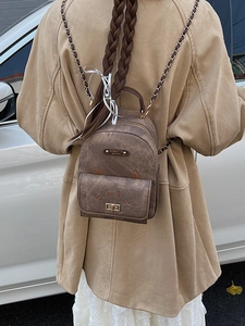 Vintage brown cat-themed backpack with metal lock and chain straps for women