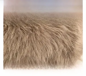 Close-up of fluffy faux fur texture and handcrafted stitching on khaki plush bag