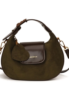 Olive green suede and brown leather crescent shoulder bag with a heart charm