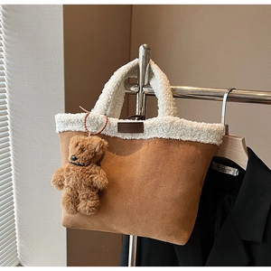 Brown faux suede tote bag with white faux fur trim and cute plush bear keychain detail