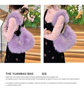 Side view of purple fluffy faux fur shoulder bag with silver bead chain strap on model