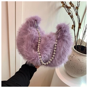 Detail of purple faux fur crescent bag with silver oversized bead chain strap