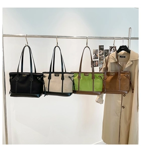 Detailed close-up showing four available colors of canvas and leather tote bags