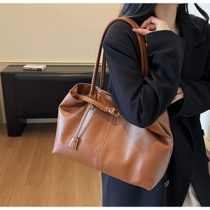 Close-up of brown vintage texture tote bag with drawstring and metal hardware