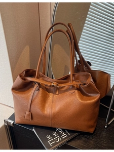 Minimalist brown PU leather tote bag with long handles and decorative metallic buckle strap