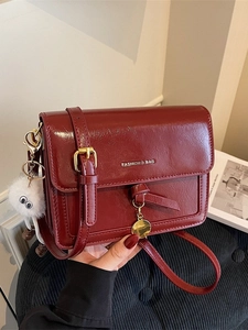 Retro burgundy square crossbody bag with glossy faux leather and cute white pompom charm