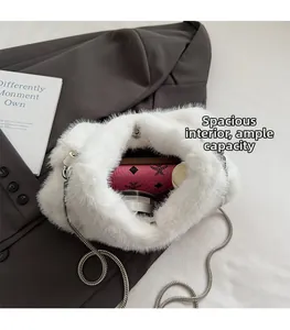 Detailed interior view of white faux fur shoulder bag showing ample space for essentials