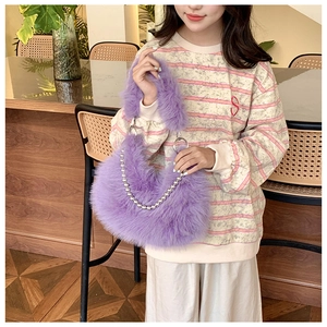 Close-up of taro purple plush half-moon bag with silver metal ball chain and ring handle