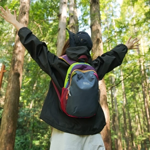 Outdoor hiking backpack with vibrant color-block design and mesh side pockets for travel