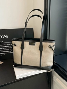 Vintage large capacity tote bag in beige canvas with black leather trim and handles