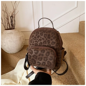 Detail of leopard print mini backpack with soft texture and adjustable straps