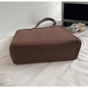 Deep brown lychee pattern leather tote bag with long straps for commute and daily use