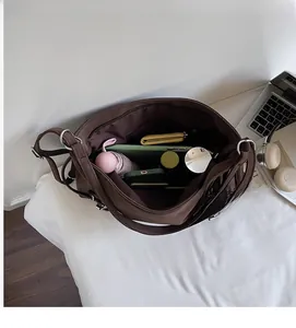 Top view of open coffee tote bag showing spacious interior with tablet and accessories
