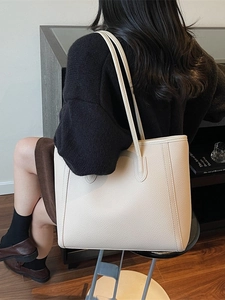 Chic beige lychee textured tote bag with large capacity and vertical stitch details