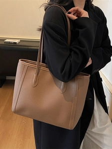 Chic brown lychee pattern leather tote bag for commuting, shown as a stylish shoulder bag