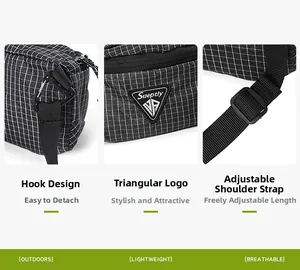 Detail showing the adjustable nylon strap, metal hook, and mesh texture of the black bag