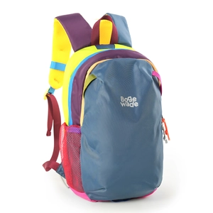 Detail of multi-color hiking backpack showing durable nylon fabric and mesh side pockets