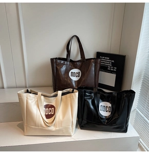 Three large PU leather tote bags in brown, beige, and black colors displayed on steps