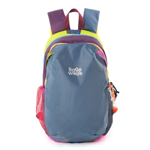Close-up of color-block nylon backpack featuring reinforced stitching and mesh side pockets