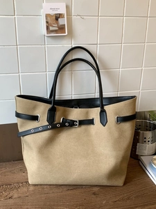 Minimalist large capacity khaki tote bag with black leather straps and silver metal buckles