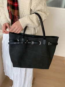Minimalist large black tote bag with buckle details and long straps for women