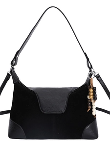 Black faux suede tote bag with leather patchwork and wooden bead charm accessory