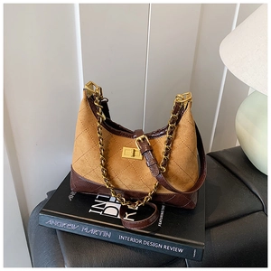 Detail of vintage color-block crossbody bag with chain and gold square buckle