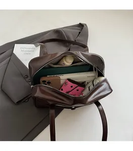 Large vintage faux leather tote interior showing high capacity for books and essentials