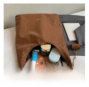 Detailed interior view of leopard print tote bag showing spacious storage capacity