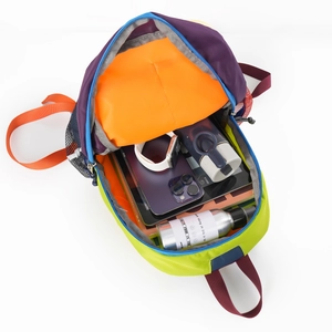 Macro shot showing internal storage space and compartments of the multi-color nylon backpack
