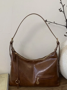 Retro large capacity dark brown hobo bag with oil wax texture and tassel detail