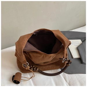 Brown suede tote bag with wooden bead handle and large capacity for autumn commuting