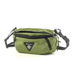 Close-up of green grid ripstop fabric and tactical buckle on casual crossbody bag