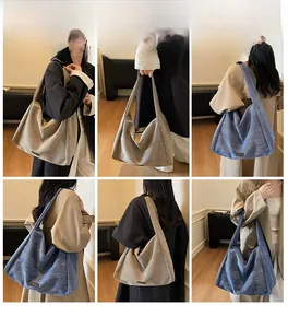 Close-up of minimalist large tote bag showing textured cotton canvas fabric and wide straps