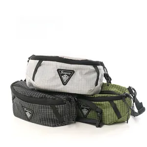 Detail of grid-patterned nylon waist bags in grey, black and olive green colors