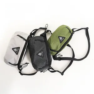 Detailed view of checkered nylon chest bags in light grey, black, and olive green colors