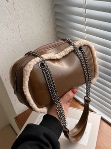 Vintage brown cylinder crossbody bag with shearling trim and stylish double chain straps