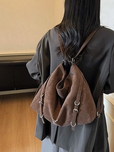 Vintage brown frosted leather backpack with dual silver buckle straps and drawstring