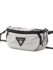 Minimalist grey checkered sling bag with dual zippers and triangle logo on white background