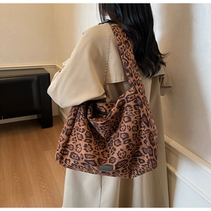 Detail of leopard print tote bag showing large capacity and thick fabric texture
