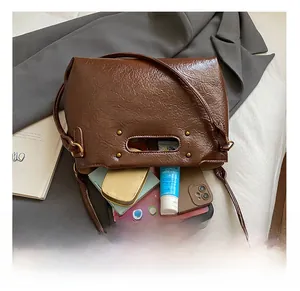 Macro shot showing large internal capacity of the vintage leather shoulder bag