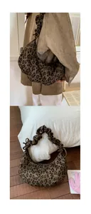 Close-up of leopard print tote bag with a wide scrunchie strap and spacious slouchy design