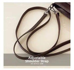 Detail of adjustable dark brown litchi pattern leather strap with metal swivel hook