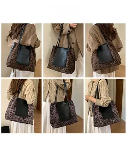 Detail of leopard print tote bag with black leather pocket and spacious shoulder design