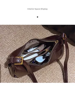 Internal layout of dark brown leather shoulder bag showing compartments and cosmetics