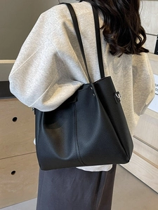 Classic black leather tote bag with pebbled texture and reinforced straps for women
