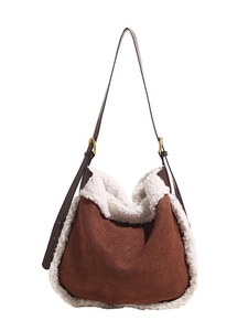 Brown faux suede tote bag with white sherpa trim and adjustable leather shoulder strap